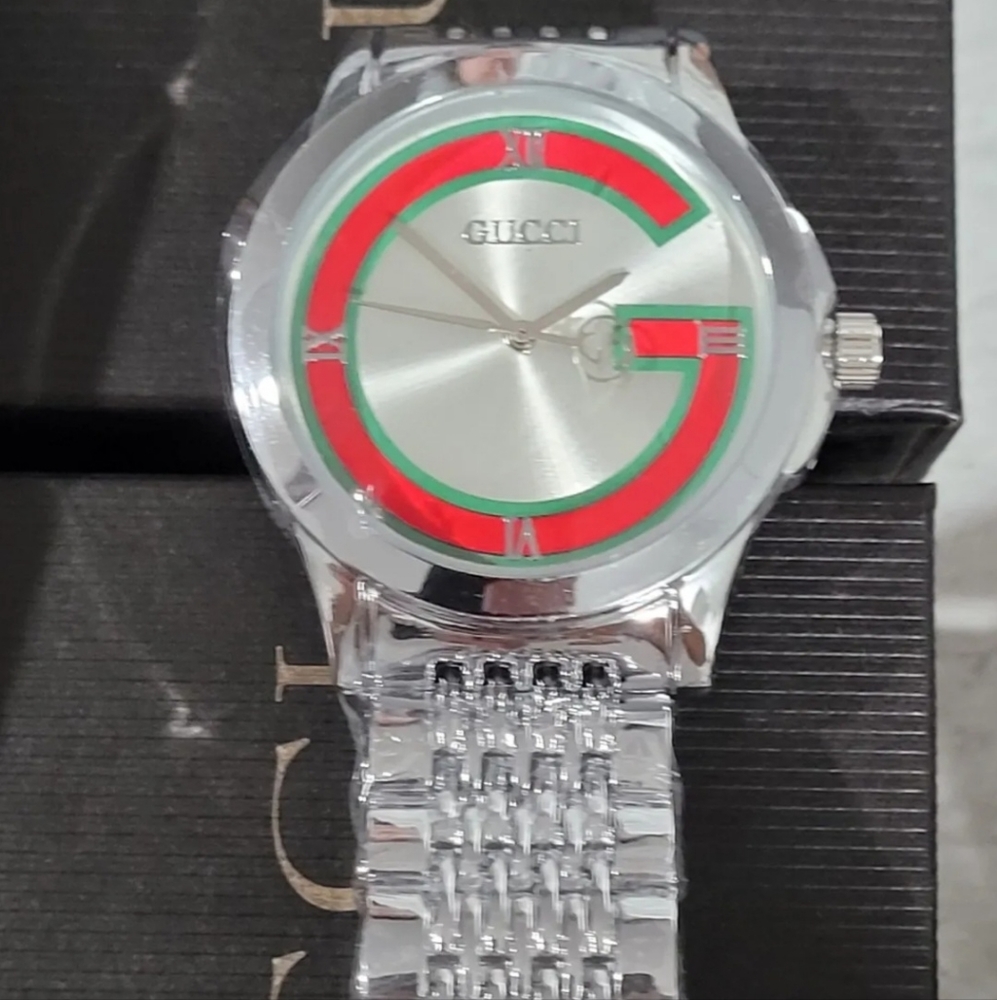 Gucci Stainless Steel Silver and GoldTones Watch Unisex. Authentic New no tag!